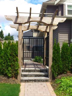 Custom built cedar arbor with a gate